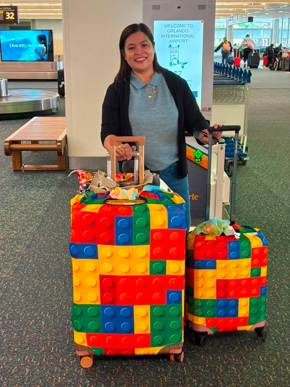 CrossBorder teacher arriving at Orlando International Airport with LEGO luggage