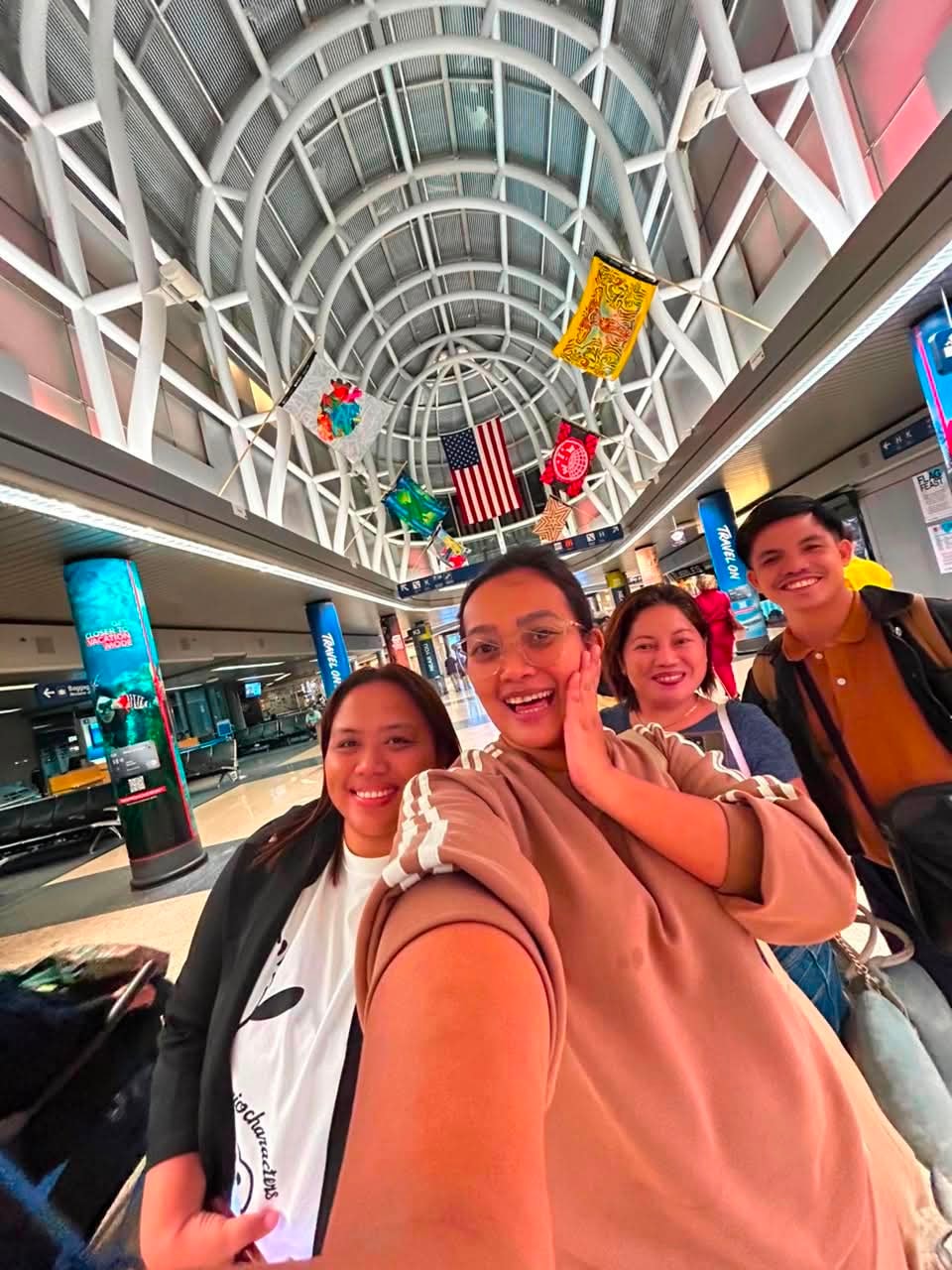 CrossBorder teachers taking a selfie at the airport terminal